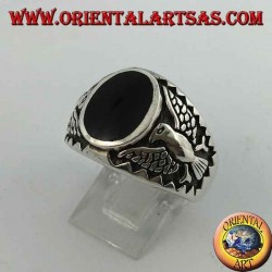 Silver ring with oval onyx and federal eagle in bas-relief on the sides