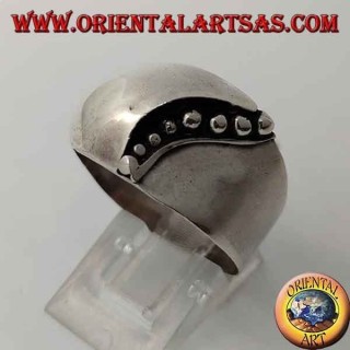 Silver ring with a convex band on the front with a curved line of dots