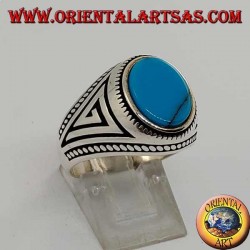 Anillo de plata con turquesa ovalada plana con trenza en los bordes del anillo.