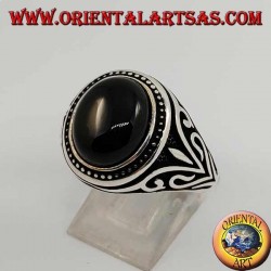 Silver ring with oval cabochon onyx with side decorations