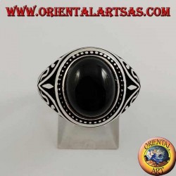 Silver ring with oval cabochon onyx with side decorations