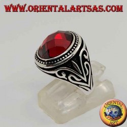 Silver ring with cabochon faceted synthetic garnet with side decorations