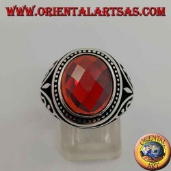 Silver ring with cabochon faceted synthetic garnet with side decorations