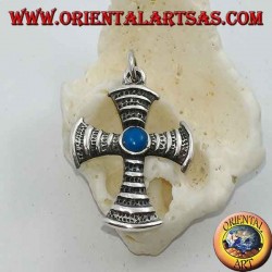 Cross-shaped silver pendant with central round turquoise