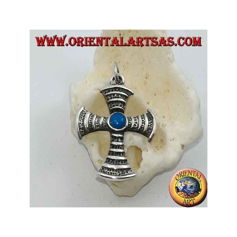 Cross-shaped silver pendant with central round turquoise