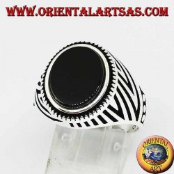 Silver ring with flat oval onyx and engravings engraved on the sides