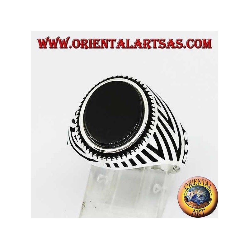 Silver ring with flat oval onyx and engravings engraved on the sides