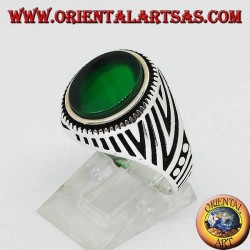 Silver ring with flat oval green agate and engravings engraved on the sides