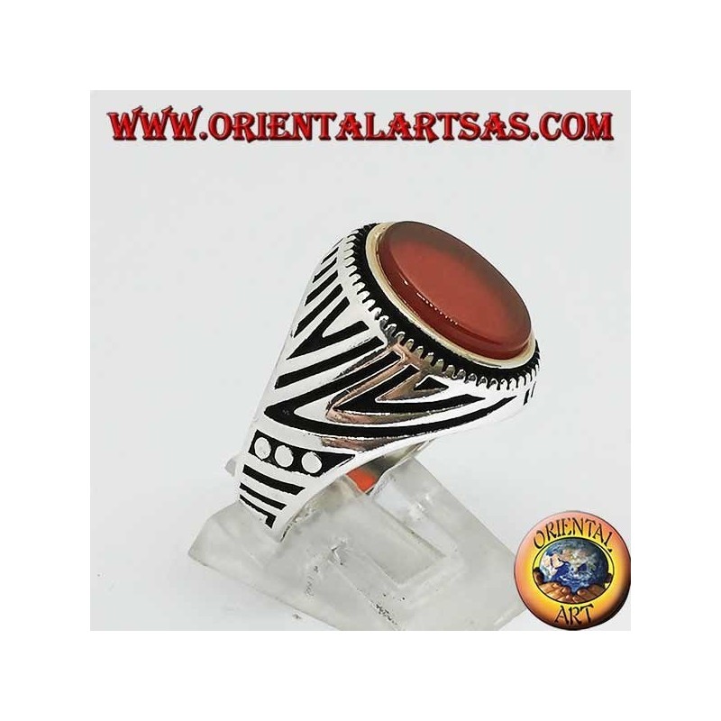 Silver ring with flat oval carnelian and engravings engraved on the sides