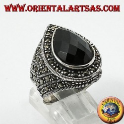 Silver ring with faceted teardrop onyx surrounded by marcasite