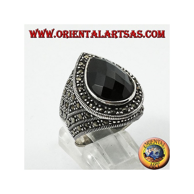 Silver ring with faceted teardrop onyx surrounded by marcasite