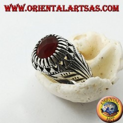 Silver ring with oval carnelian set and carvings on the sides