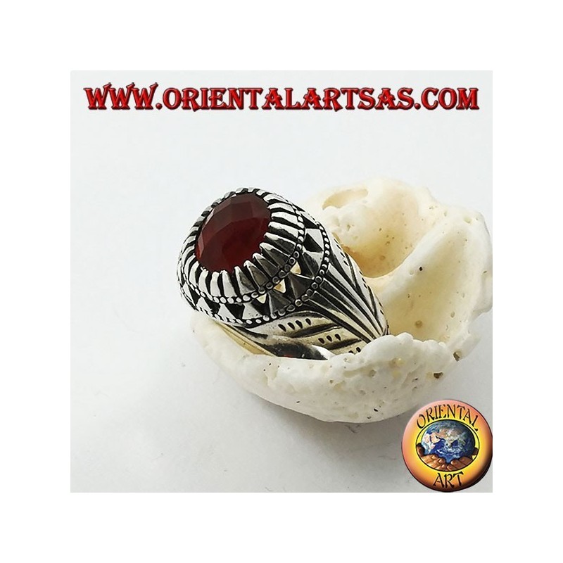 Silver ring with oval carnelian set and carvings on the sides