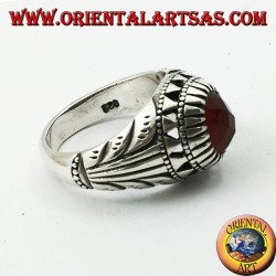 Silver ring with oval carnelian set and carvings on the sides