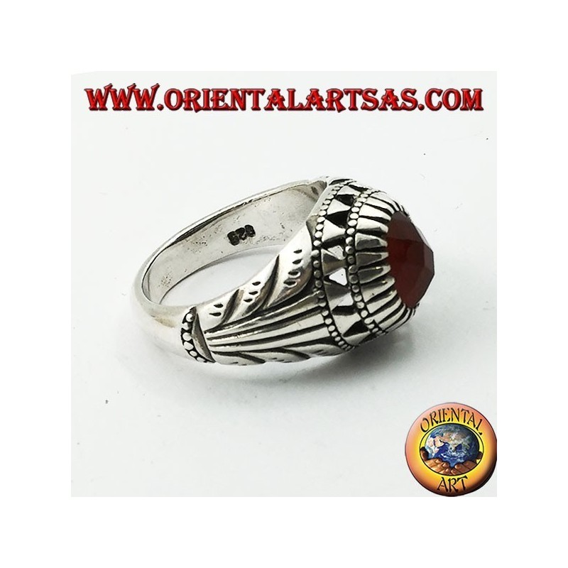 Silver ring with oval carnelian set and carvings on the sides