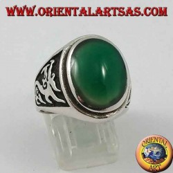 Silver ring with oval green agate and dragon in high relief on the sides