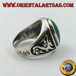 Silver ring with oval green agate and dragon in high relief on the sides
