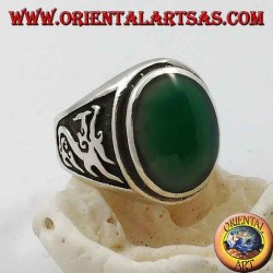 Silver ring with oval green agate and dragon in high relief on the sides