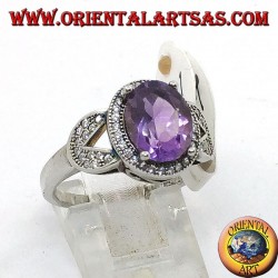 Silver ring with oval natural amethyst set surrounded by zircons