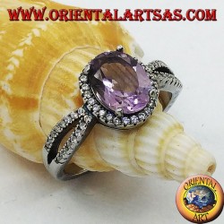 Silver ring with oval natural amethyst set with two rows of zircons on the sides