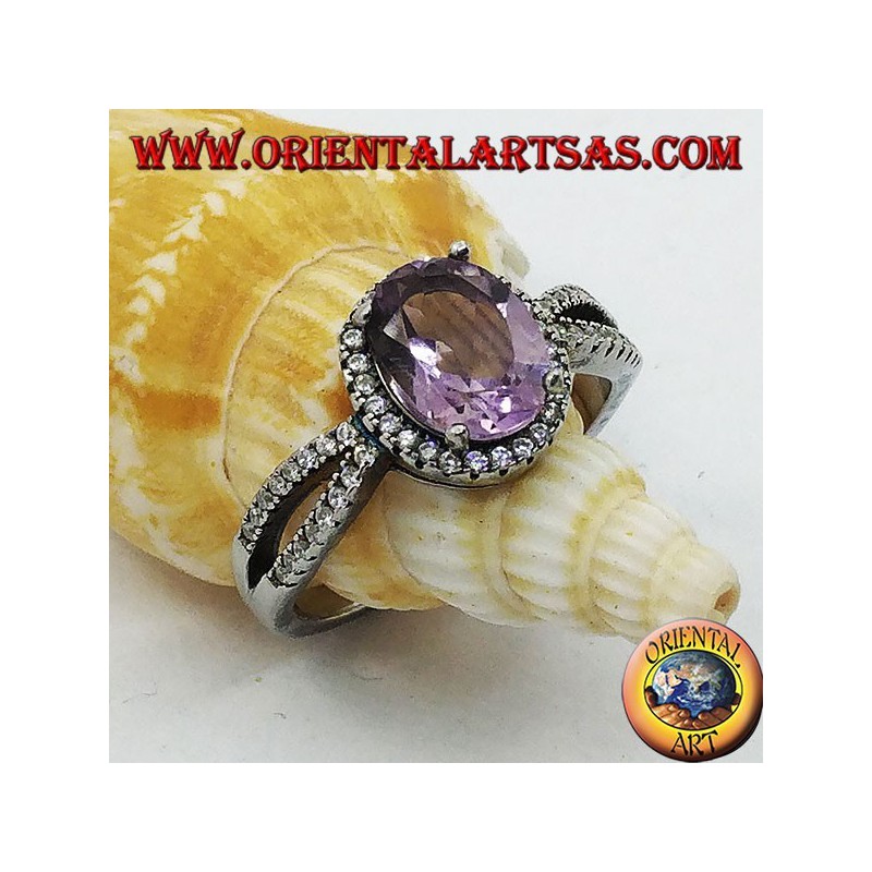 Silver ring with oval natural amethyst set with two rows of zircons on the sides