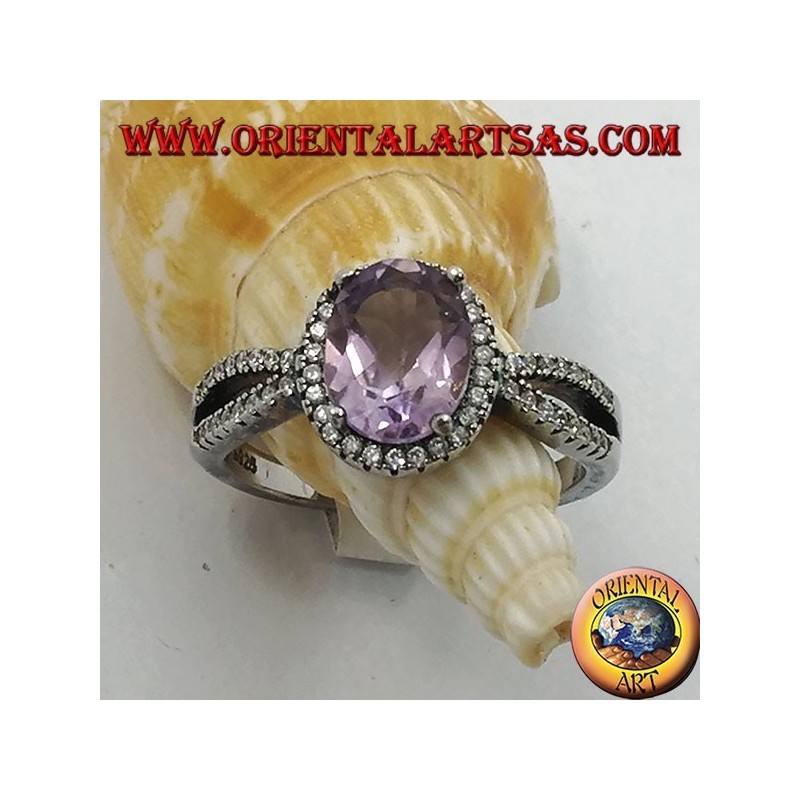Silver ring with oval natural amethyst set with two rows of zircons on the sides