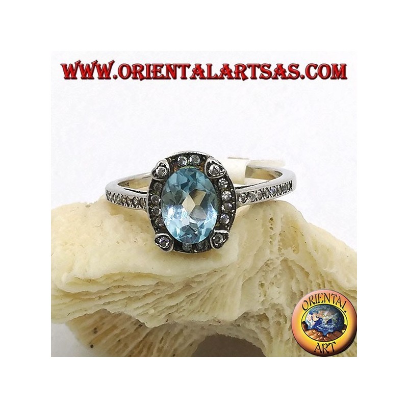 Silberring mit natürlichem ovalen blauen Topas, umgeben von Zirkonen
