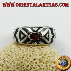 Rounded silver ring with oval garnet and niello decoration