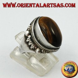 Silver ring with oval cabochon tiger's eye and Indian decorations