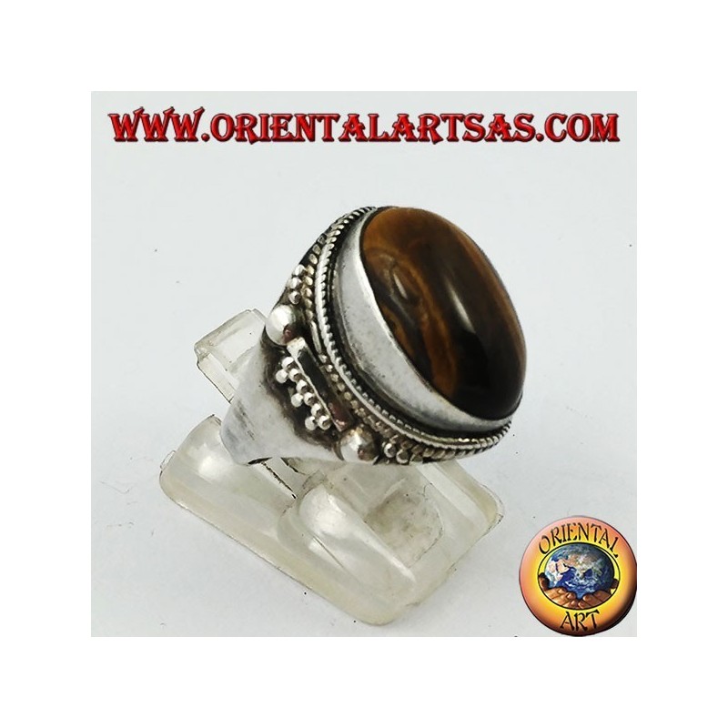 Anillo de plata con cabujón ovalado ojo de tigre y decoraciones indias