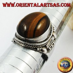 Silver ring with oval cabochon tiger's eye and Indian decorations