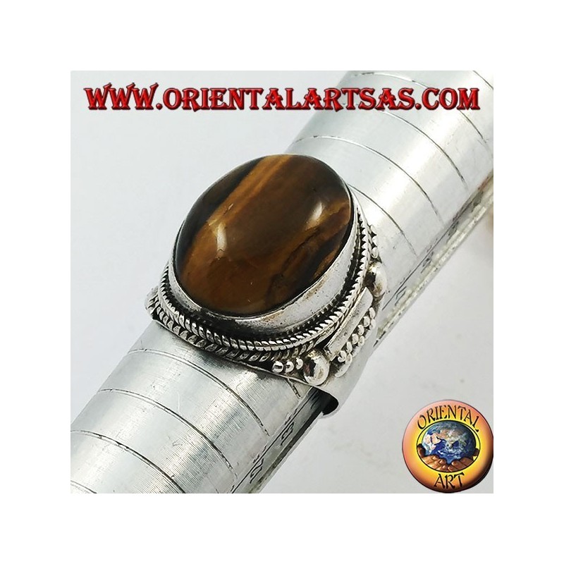 Silver ring with oval cabochon tiger's eye and Indian decorations