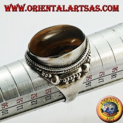 Silver ring with oval cabochon tiger's eye and Indian decorations