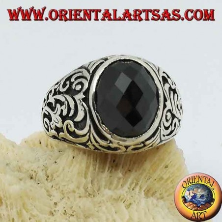 Silver ring with oval faceted onyx and floral engravings