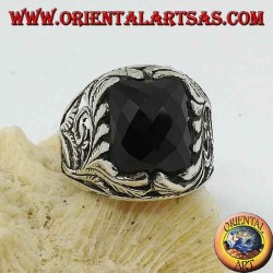 Silver ring with faceted rectangular onyx and openwork floral decorations