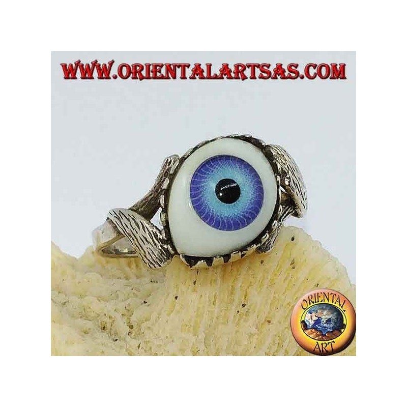 Silver ring with blue eye diagonally between two leaves