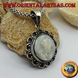 Silver cameo pendant on mother of pearl surrounded by silver and garnet flower
