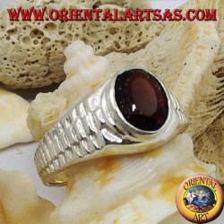Silver ring with oval garnet and clock link decoration