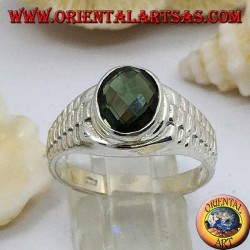 Silver ring with oval green zircon and clock link decoration