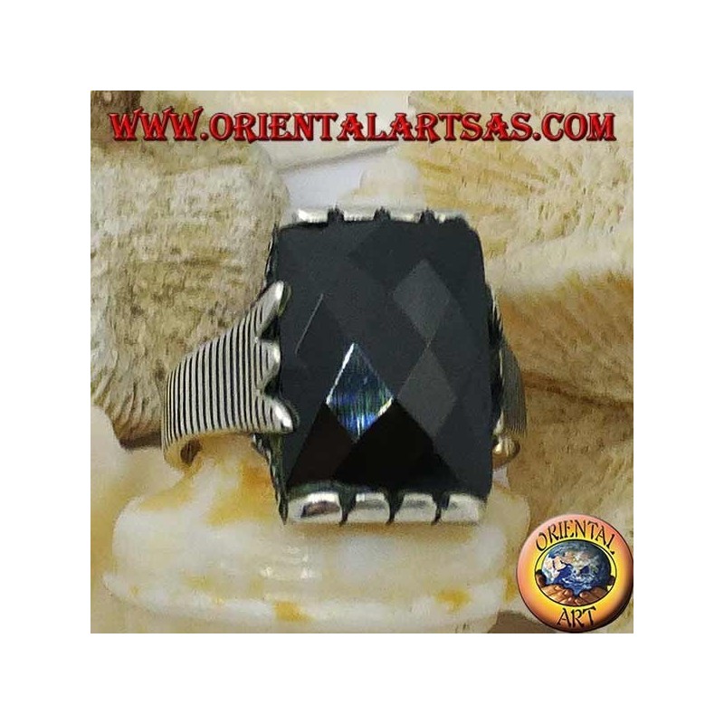 Silver ring with faceted rectangular onyx and clip frame