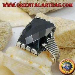 Silver ring with faceted rectangular onyx and clip frame