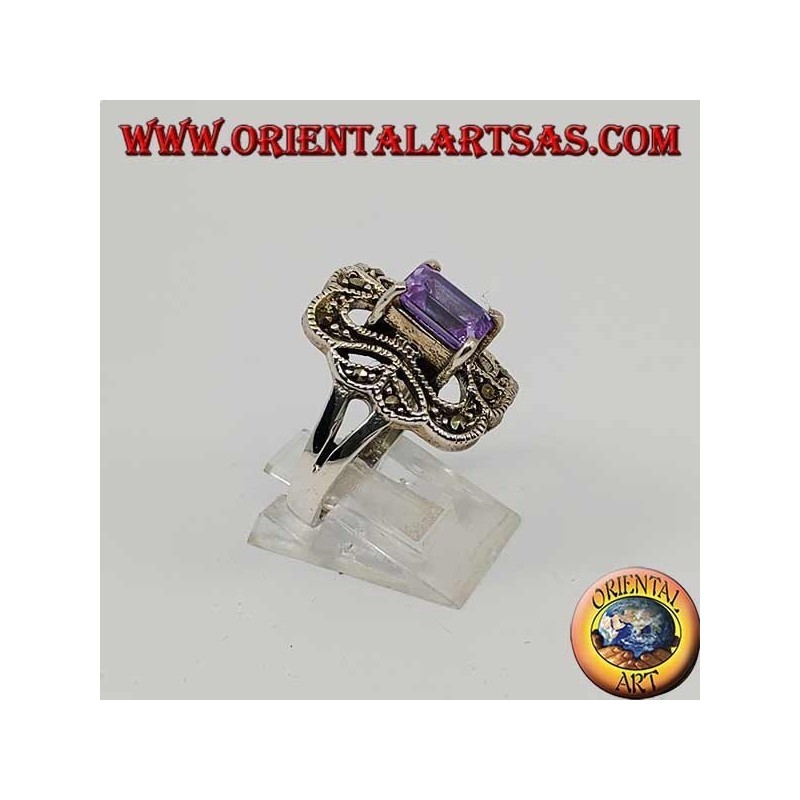 Beveled silver ring with rectangular amethyst set surrounded by marcasite