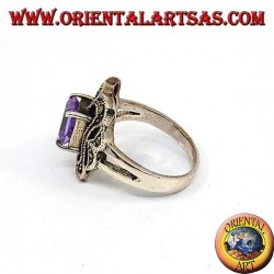 Beveled silver ring with rectangular amethyst set surrounded by marcasite