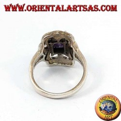 Beveled silver ring with rectangular amethyst set surrounded by marcasite