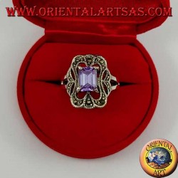 Beveled silver ring with rectangular amethyst set surrounded by marcasite