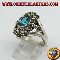 Anillo de plata margarita con topacio azul ovalado y marcasita