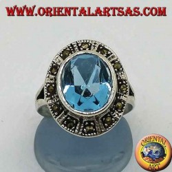 Large oval silver ring with blue topaz surrounded by marcasite