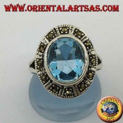 Large oval silver ring with blue topaz surrounded by marcasite