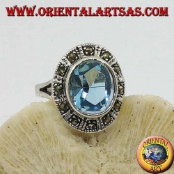 Large oval silver ring with blue topaz surrounded by marcasite