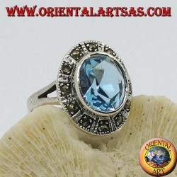 Large oval silver ring with blue topaz surrounded by marcasite